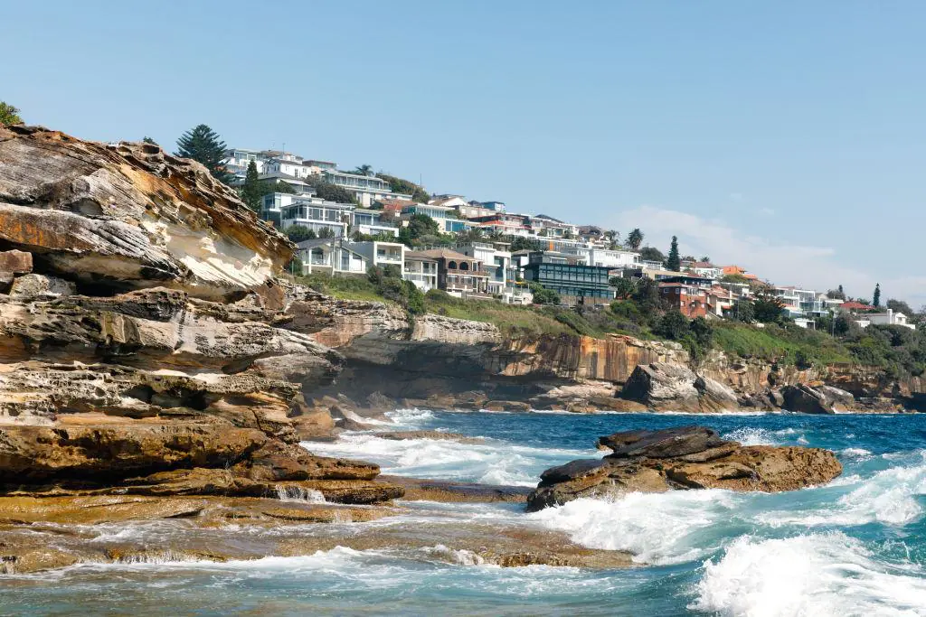 Coastal cliffside homes in South Coogee overlooking the ocean, capturing the area's steep terrain and residential setting ideal for in-home physiotherapy support.