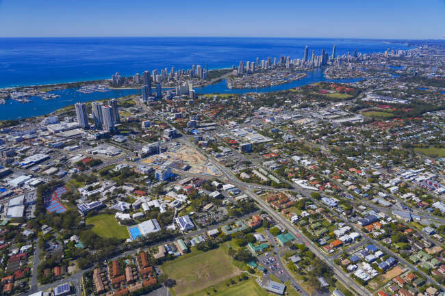 Aerial view of central Gold Coast suburbs, showcasing residential and commercial zones—ideal region for mobile physiotherapy services with in-home care across Southport, Ashmore, and Robina.