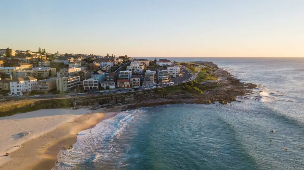 Aerial view of Maroubra’s coastline at sunset, showing beachside homes and steep streets — highlighting the need for accessible mobile physiotherapy in the area.