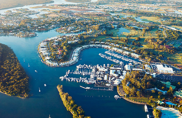 Aerial view of marina-lined Hope Island in North Gold Coast—serviced by mobile physiotherapists delivering in-home NDIS, aged care, and rehab support across northern suburbs.