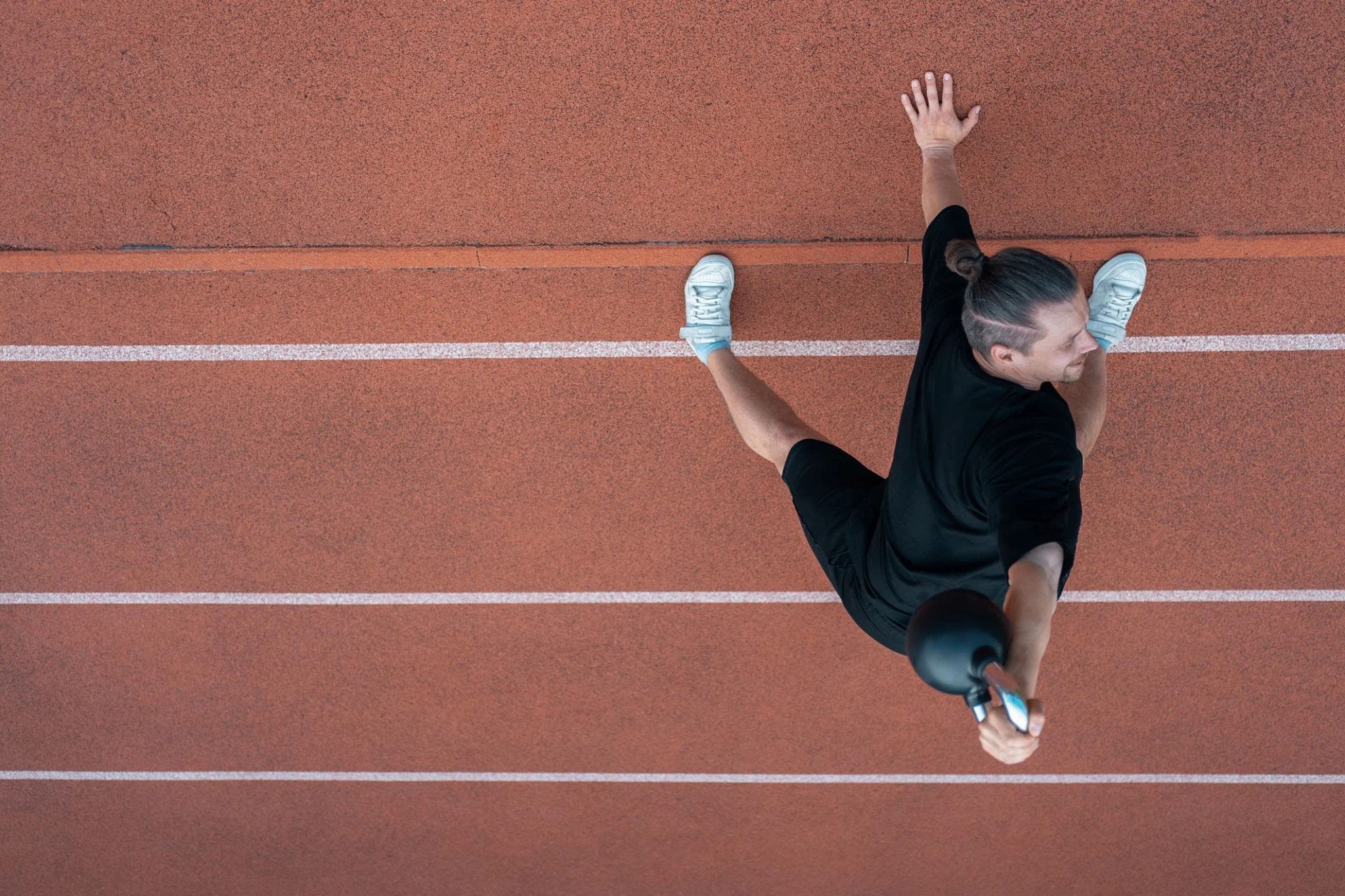 Athlete performing sport-specific exercise or movement drill in home or training setting. Shows correct form, athletic environment, functional training.